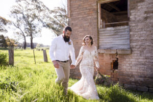 Jasmin and Cameron holding hand at country New South Wales wedding