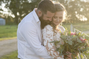 bride and groom hugging in sunlight at country New South Wales wedding