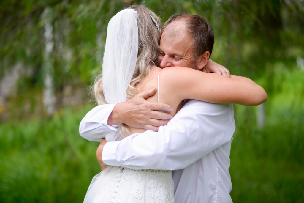1 bride and father hugging captured by wedding photographer in Melbourne