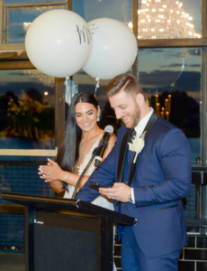 Bride and groom photographed during speech at Melbourne wedding