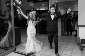 Bride and groom entering wedding reception in Camden New South Wales