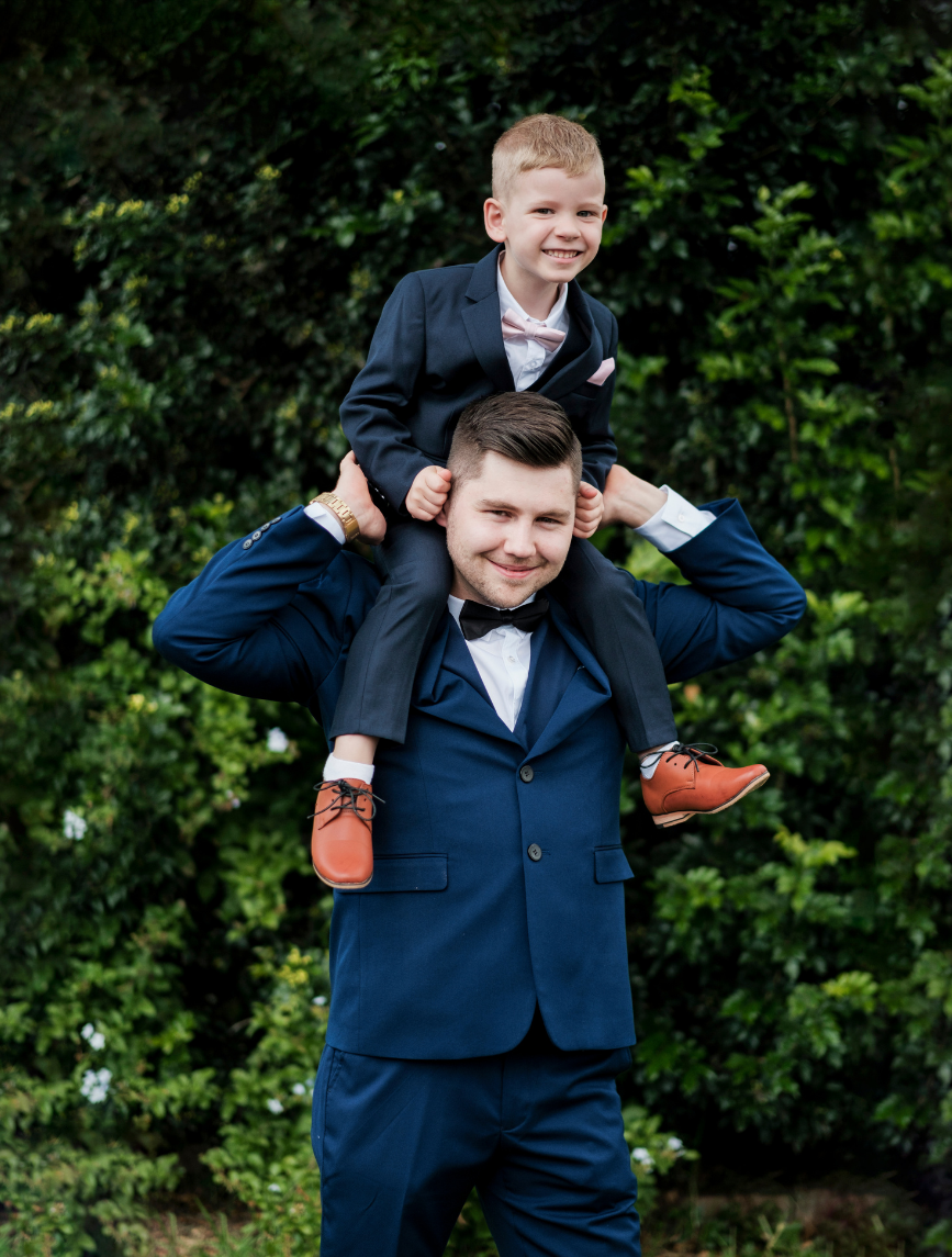 1 Groom and ring bearer captured by wedding photographer in Camden