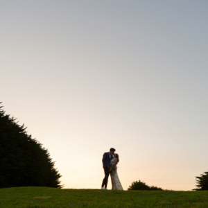 Bride and groom kissing at sunset after Melbourne wedding