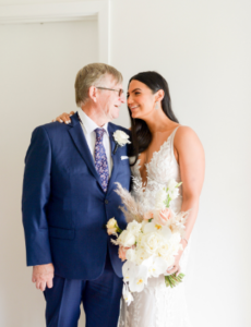 Bride and father laughing before wedding in Melbourne