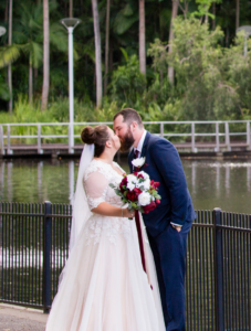 Bride and groom kissing at Roma Botanical Gardens in Brisbane