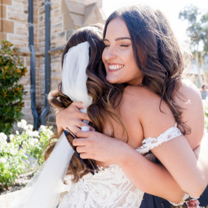 Bride hugging friend after wedding in Fremantle