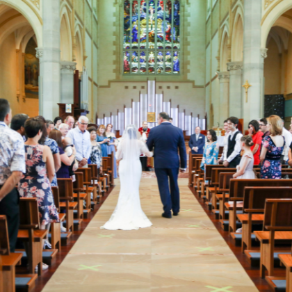 Bride being walked down aisle by father at Perth church wedding