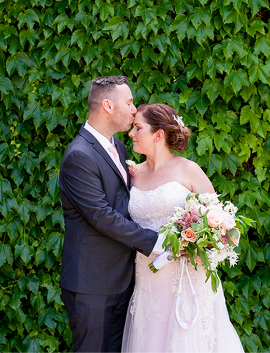 Groom kissing brides forehead at Adelaide wedding