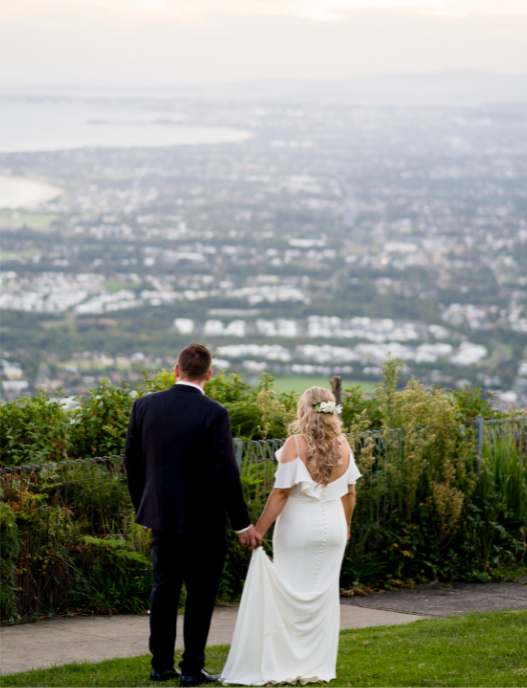 Bride and groom overlooking Wollongong at Sublime Point wedding