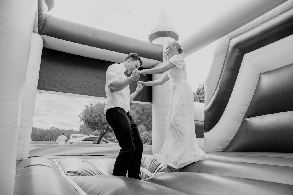 Newlywed couple photographed on bouncy castle in Melbourne