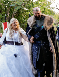 bride and groom walking down aisle at viking themed wedding
