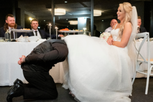garter toss in Wollongong captured by wedding photographer