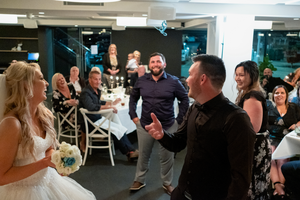 photograph of garter toss at wedding reception in Wollongong NSW