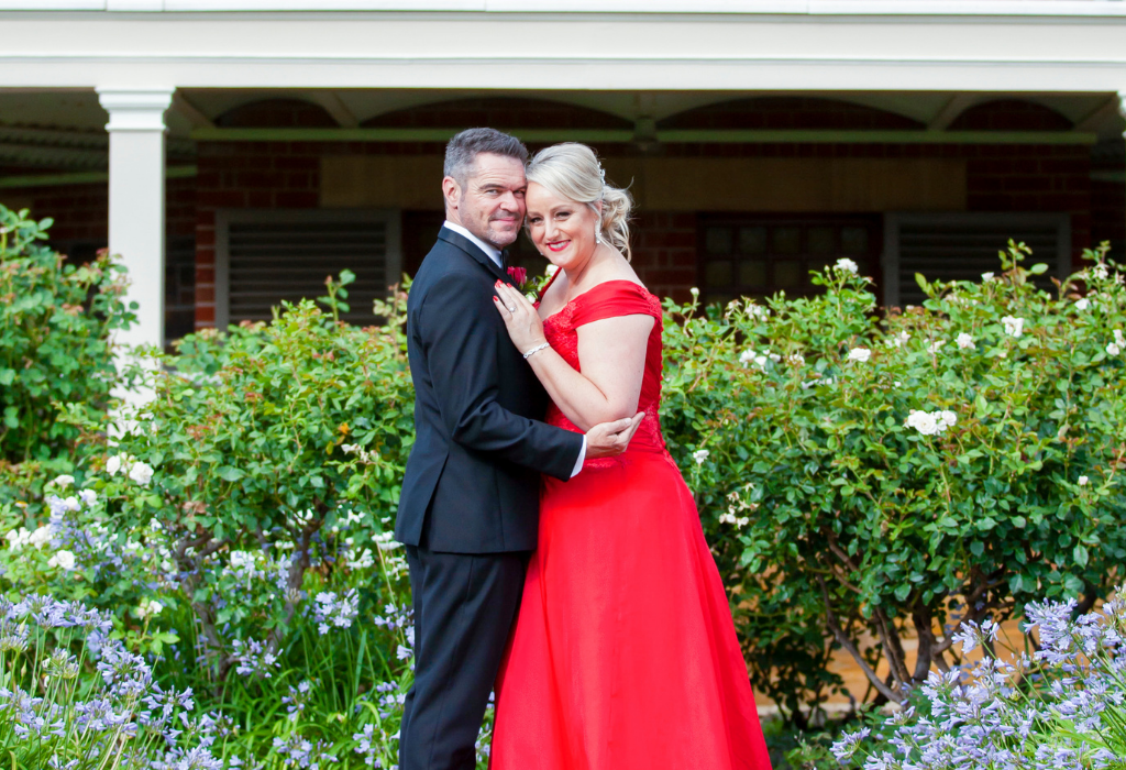 1 Bride in red dress hugging groom Adelaide wedding