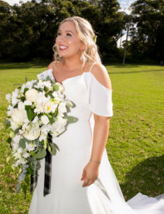 Bride with white and green bouquet