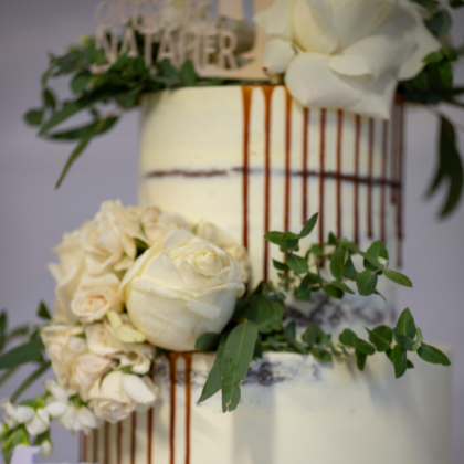 white rose wedding cake photographed close up
