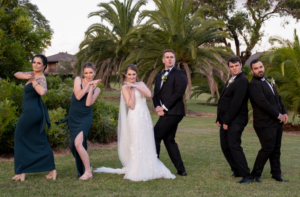wedding party posing with fake hand guns at Cropley House