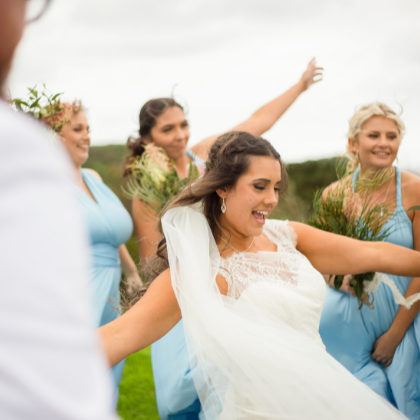 1 bride and wedding party photographed dancing in Sydney