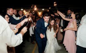 Bride and groom reception exit under sparklers