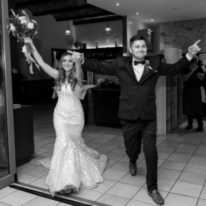 1 bride and groom photographed entering reception at Camden wedding