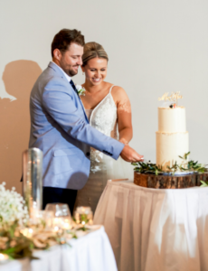1 newlyweds cutting cake at wedding reception