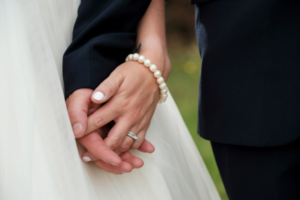 Close up photo of bride and groom holding hands at New South Wales wedding