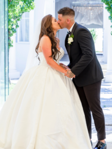 Bride and groom kissing at Sheldon Reception wedding ceremony