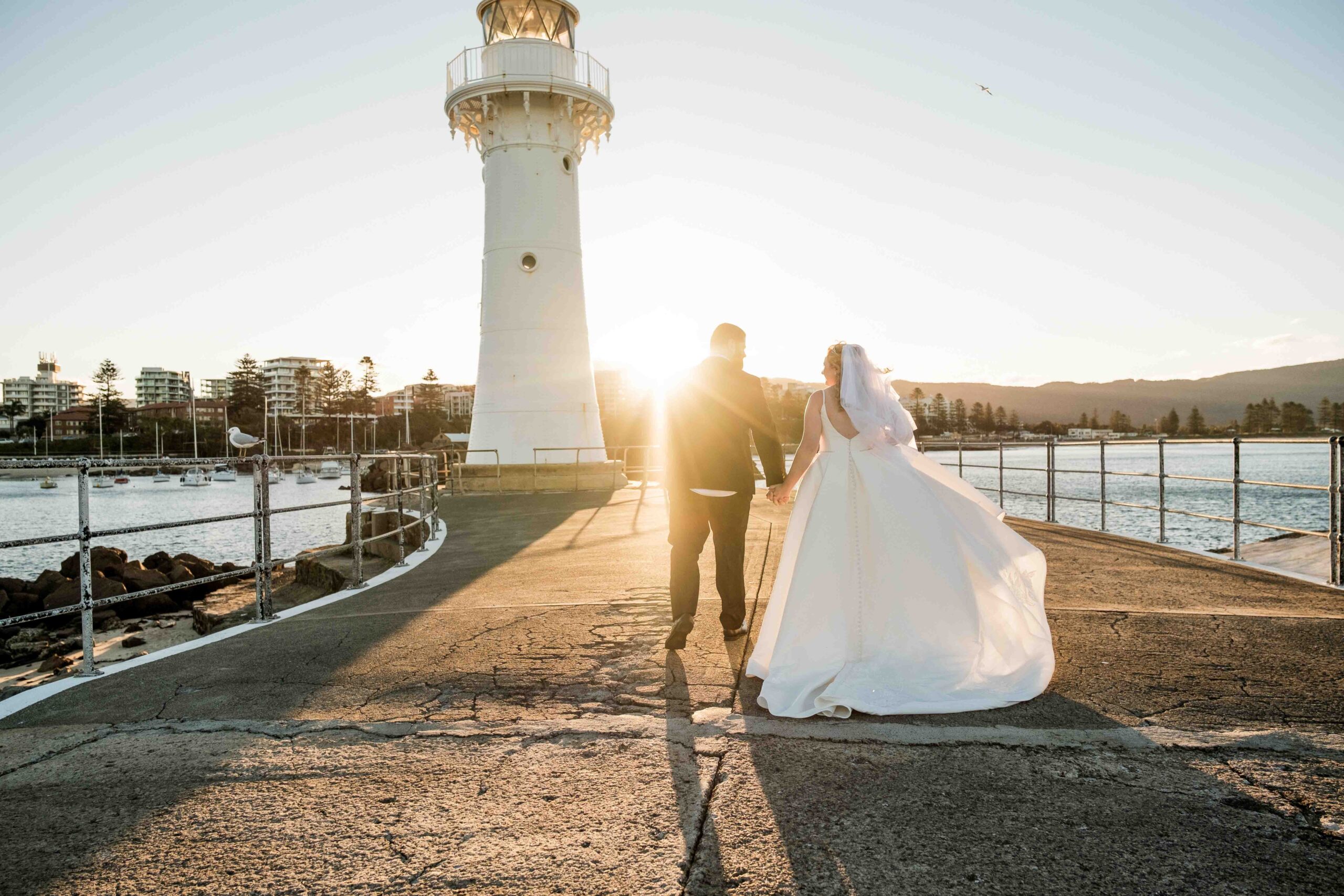 sunset photos of bride and groom at Wollongong Breakwater Lighthouse