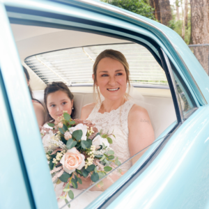 bride photographed in car before wedding