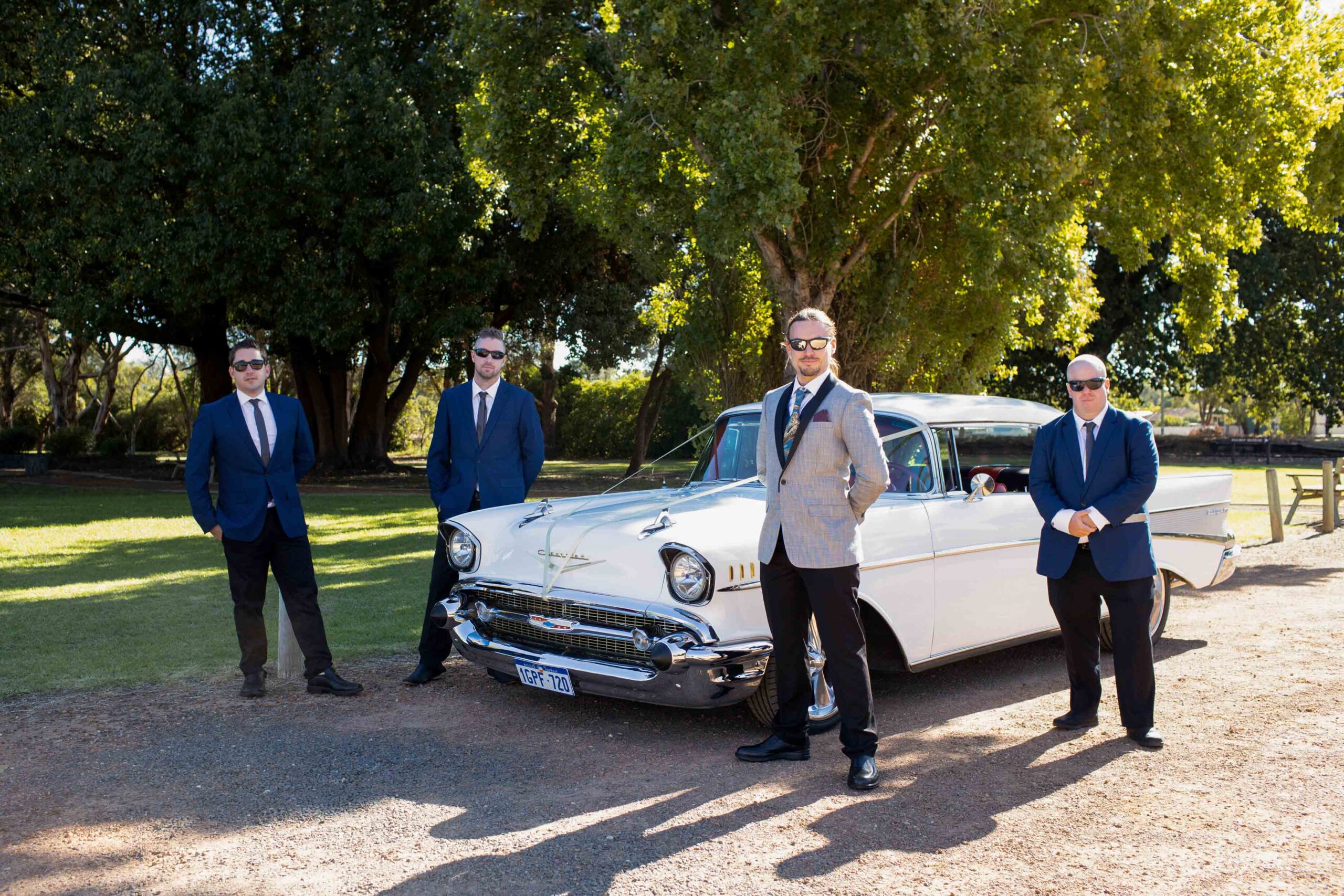 groom and groomsmen posing for wedding photographer in Perth Western Australia