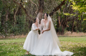 bride and bride taking champagne photo at Melbourne wedding