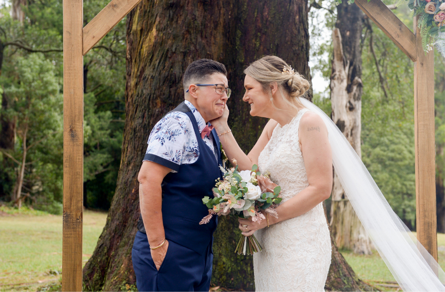 moment between brides captured by Melbourne wedding photographer