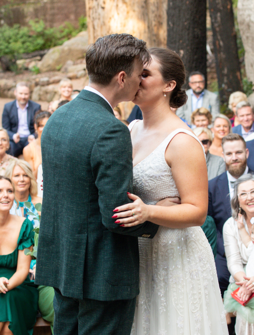 bride and groom kissing at Canberra wedding ceremony
