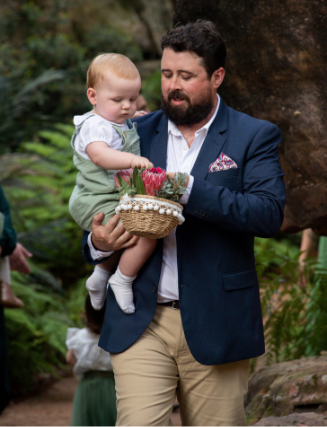groomsmen and flower boy walking down aisle at Canberra wedding