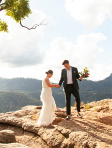 couple posing on rocks for Canberra wedding photographer