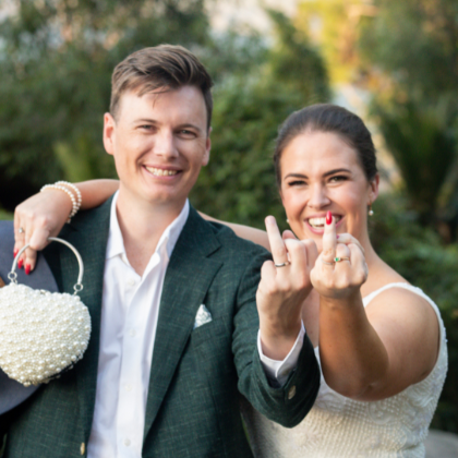 bride and groom showing rings to Canberra wedding photographer