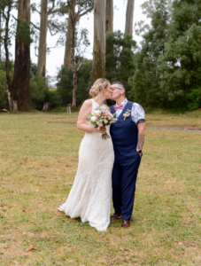 bride and bride kissing after Melbourne wedding