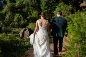 bride and groom walking through Kangaroo Valley Bush Retreat