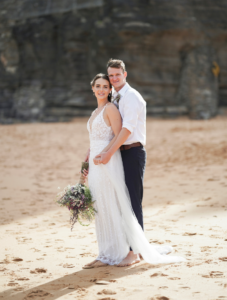 couple posing for wedding photographer on Bigola beach