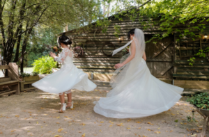 brides dancing after wedding ceremony at Log Cabin Ranch