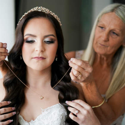 bride putting on necklace before Wollongong wedding