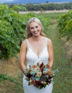bride posing for photographer at Yering Farm Wines wedding