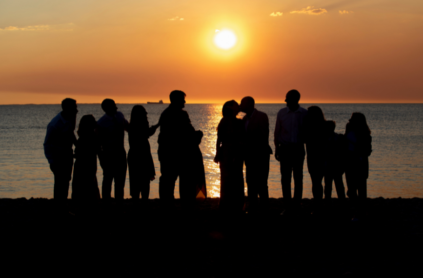 wedding party at sunset on port beach in Fremantle