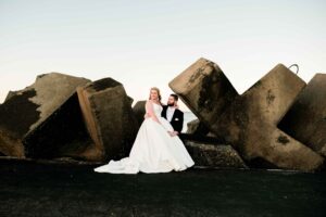 couple posing for wedding photograher in wollongong