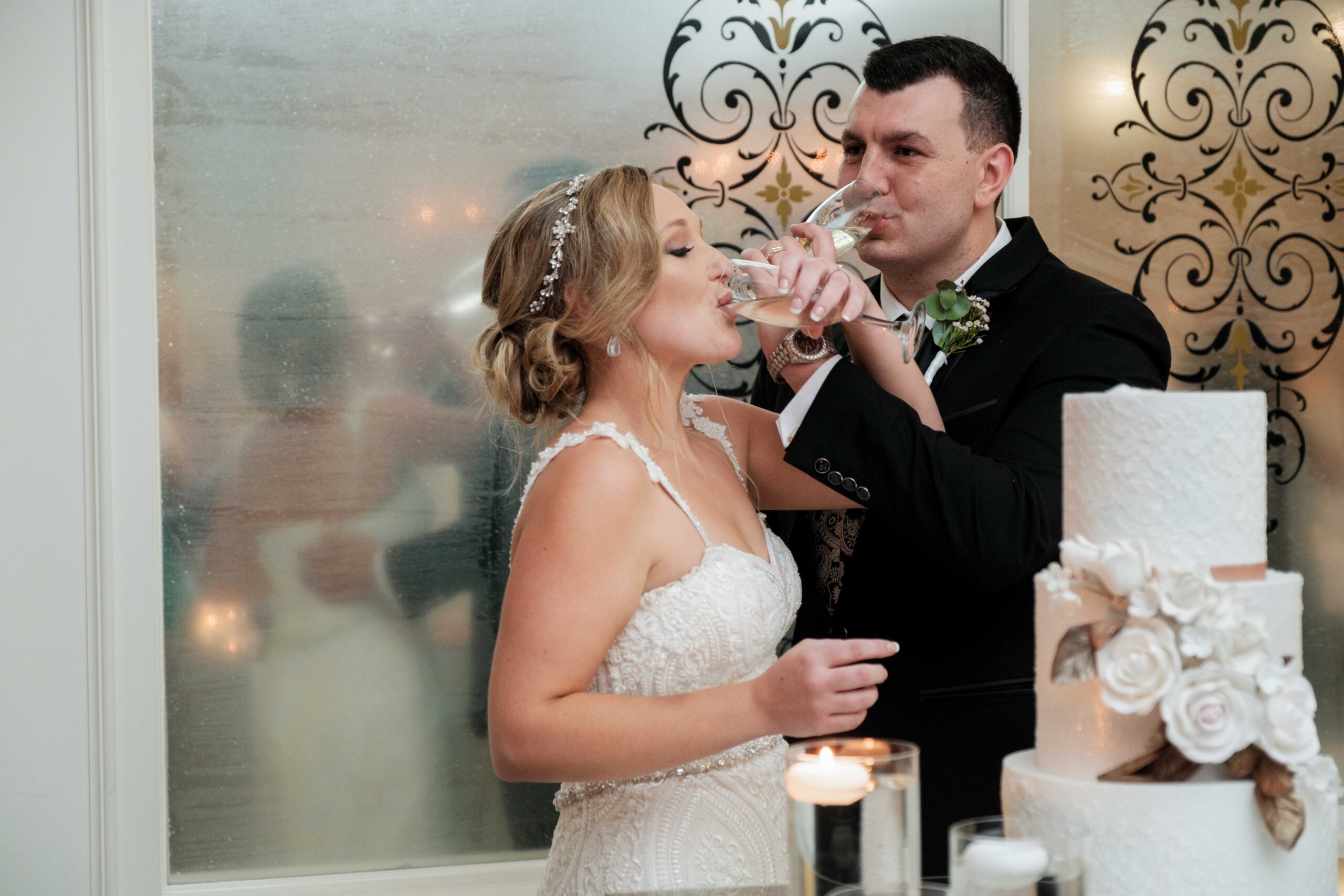 bride and groom with champagne at wedding ceremony