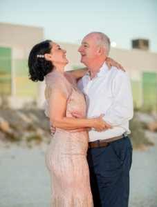 couple laughing on port beach in Fremantle after wedding