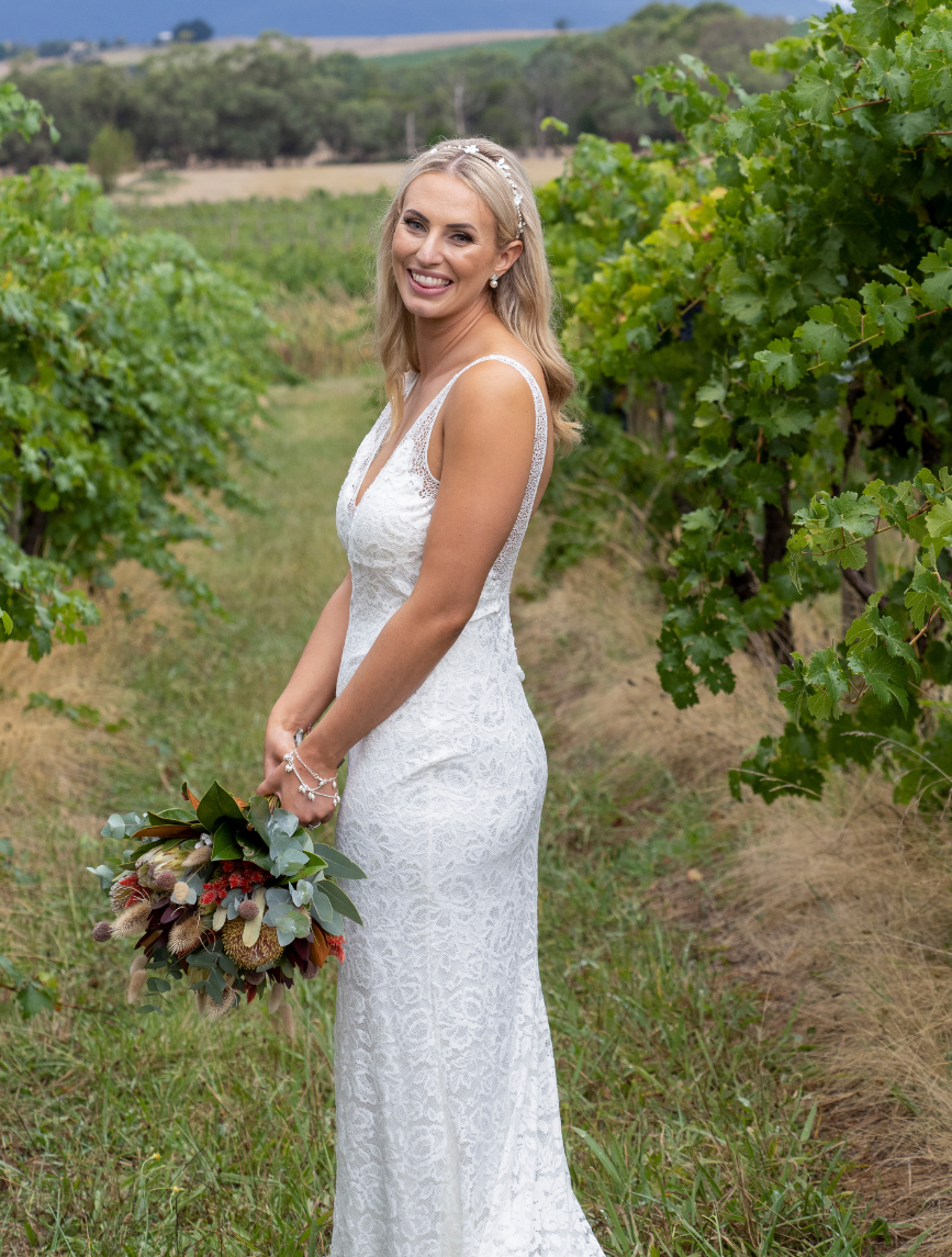 bride posing for wedding photographer at Yering Farm Wines in Melbourne