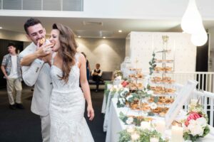 bride and groom eating at Fremantle wedding reception