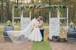 Newly-weds sharing a kiss at Kookaburra Hideaway after wedding ceremony.
