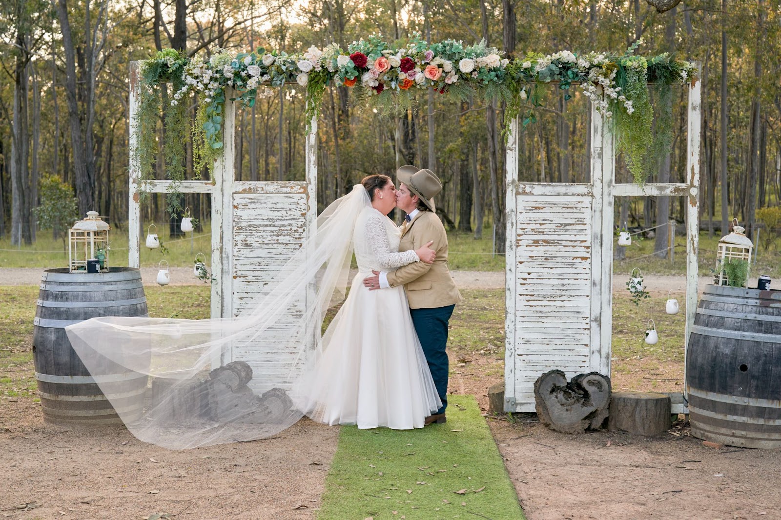 Newly-weds sharing a kiss at Kookaburra Hideaway after wedding ceremony.